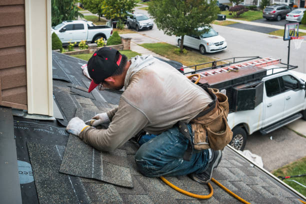 Professional Roofing technician working in Seaside, OR